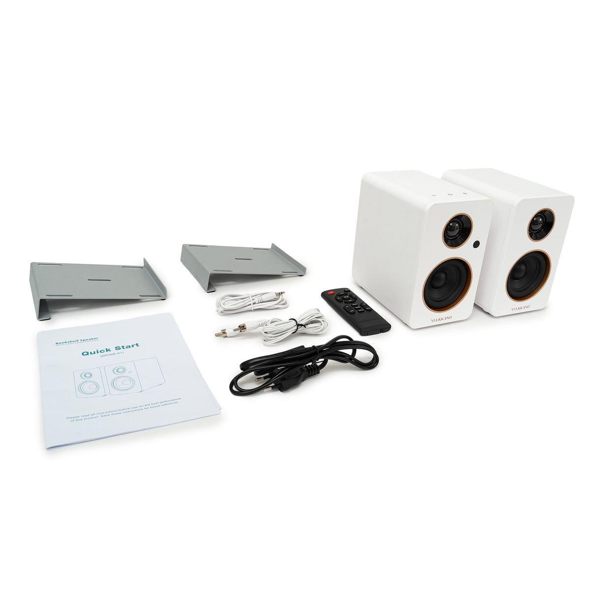 Contenido de la caja del VULKKANO DESK: altavoces, soportes inclinados, mando, cables y manual